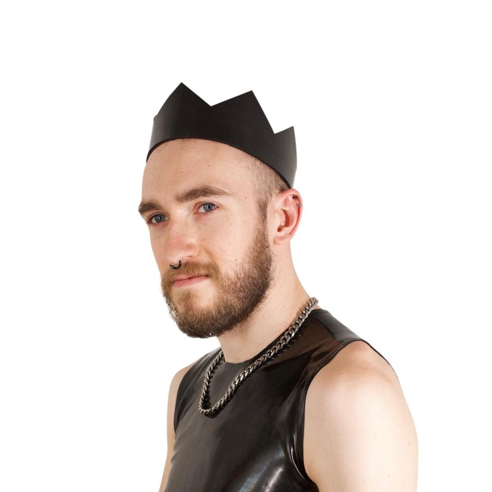 Rubber Crown - Vilain Garçon - a heavy rubber crown on the head of a kinkster gazing afar